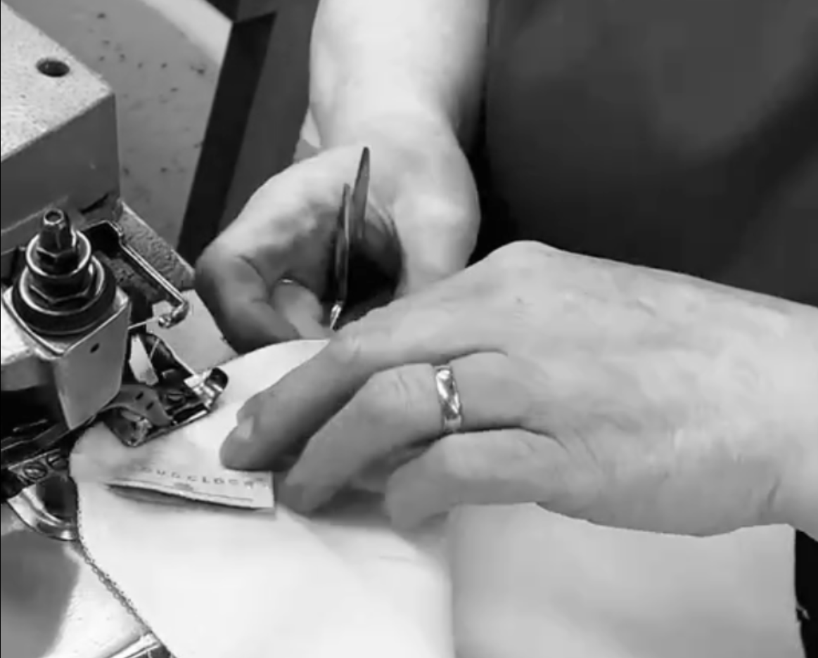 British Seamstress Sewing CloudCloths on overlock machine in Greater Manchester